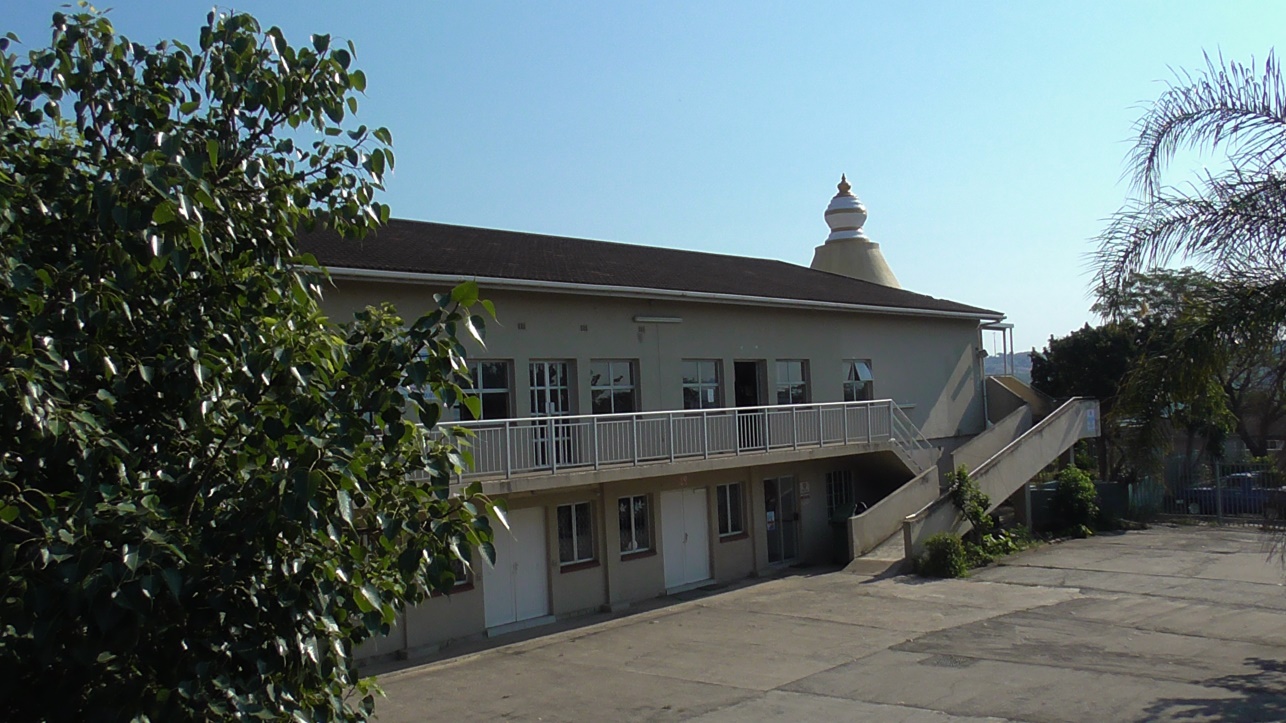 The Sabha building seen across its forecourt, with a staircase to the upper floor